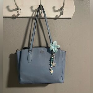 Elegant Blue Handbag with Charm
